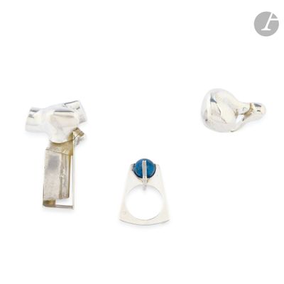 three rings and a ring with a blue stone on a white background