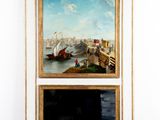 deux tableaux accrochés au mur d'une pièce dotée d'une cheminée