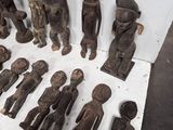 a lot of wooden figurines that are sitting on a table