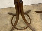 pair of wooden table legs with a metal base and a wooden top
