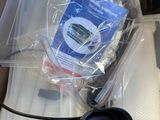 a box with a laptop, mouse, and other items in it