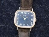 a close up of a wrist watch with roman numerals on it