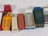 a lot of toy trucks that are lined up on a table