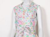 an image of a mannequin wearing a dress with flowers on it