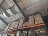 many boxes on the shelves in the warehouse