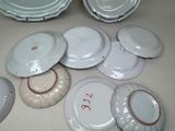 a lot of plates that are sitting on a table