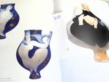 a picture of a book with pictures of vases on it