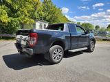 a black pickup truck parked in a parking lot