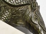 a statue of a horse that is on a shelf