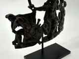statue of a man on a horse with a sword and a woman on a horse