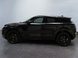 a black range rover parked in a room with a white wall