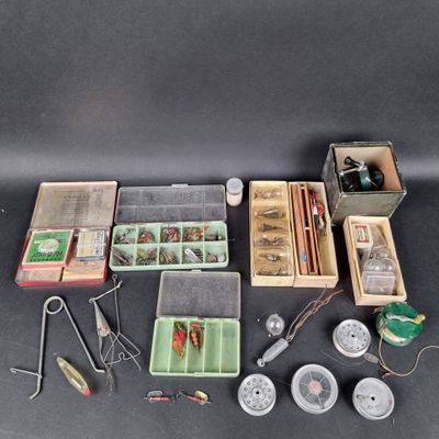 many different types of fishing equipment on the table