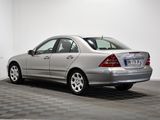 a picture of a silver car parked in a garage