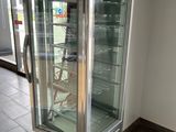 an image of a glass door refrigerator in a store