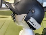 a helmet and a pair of sunglasses sitting on a table