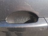 a car door handle with a hole in it