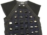 a black top with holes cut out of it