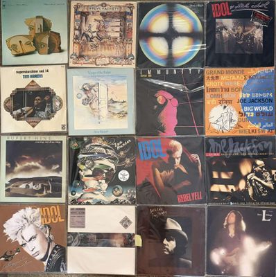 a wall full of various album covers on the wall