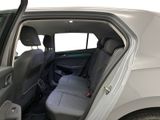 the back seat of a car with the door open and the driver ' s seat folded down