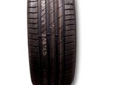 a close up of a car tire on a white surface