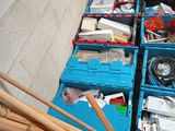 many boxes of assorted items sitting on the floor