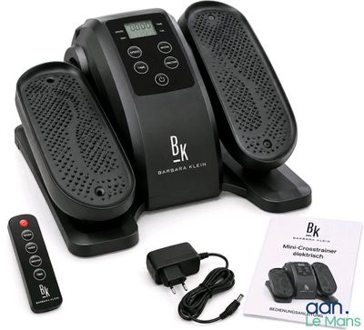 three foot massagers and a remote control on the table
