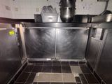an image of a commercial kitchen with stainless steel cabinets
