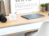 a picture of a desk with a laptop on it