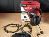 an image of a pair of headphones sitting on top of a wooden table