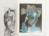 an open book with a drawing of a man and a drawing of a woman