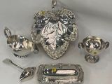 a lot of silver items that are on a table