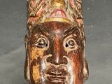 an image of a carved head of a man