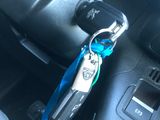 a car key in the center of a car with a lanyard attached to it