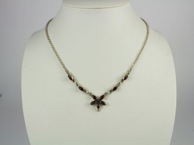 a close up of a necklace on a mannequin mannequin
