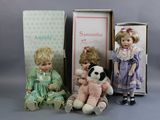 three dolls sitting next to each other on a table