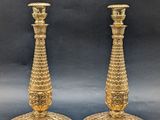 pair of antique brass candlesticks with ornate design