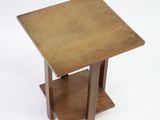 an image of a small wooden table with a square top