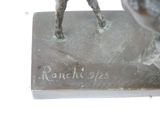 a statue of a man riding a horse on top of a base