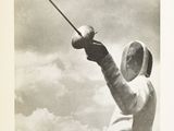a black and white photo of a man holding a sword