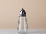 a salt and pepper shaker sitting on a table