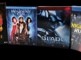 four blu - ray movies on display on a black background