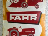 a sign with a tractor and a tractor on it