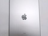 a close up of the back of an ipad with a silver apple logo on it