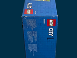 a blue box with a train on it sitting on a table