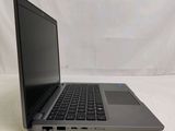 an open laptop computer sitting on top of a white table