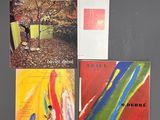 four different album covers of different colors and sizes on a gray surface
