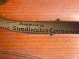 a close up of a violin with a label on it