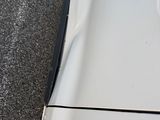 a close up of a car ' s hood with the hood off