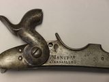 a small metal object that is on top of a table