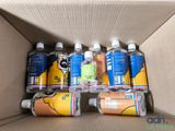 a cardboard box filled with bottles of soda and water